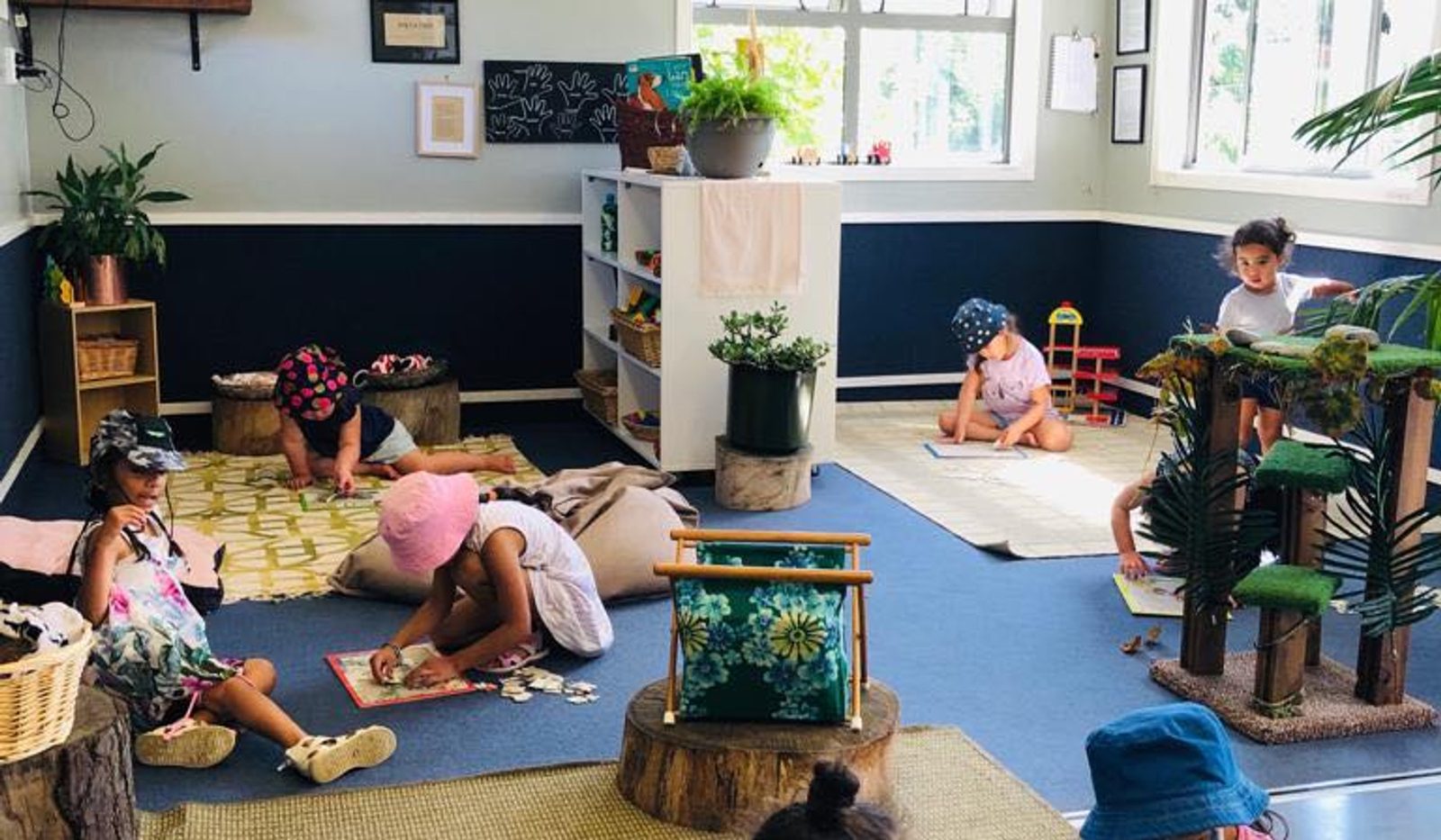 Children exploring different activities in The Miller Nest learning environment
