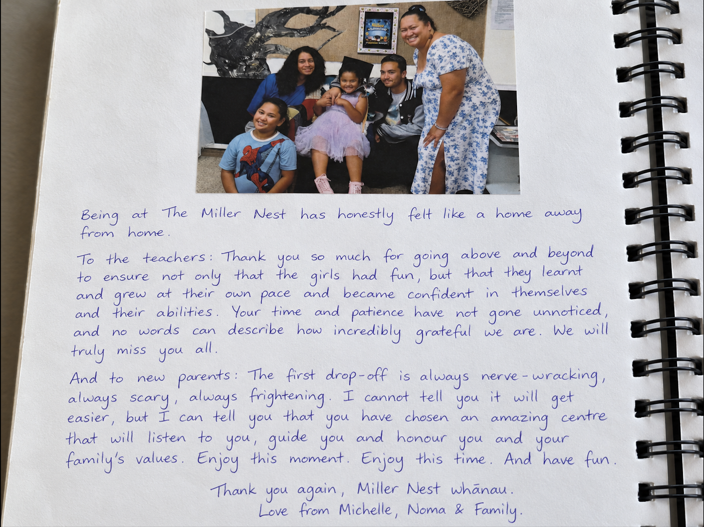 Handwritten feedback from Michelle, Noma & Family, with their family photograph